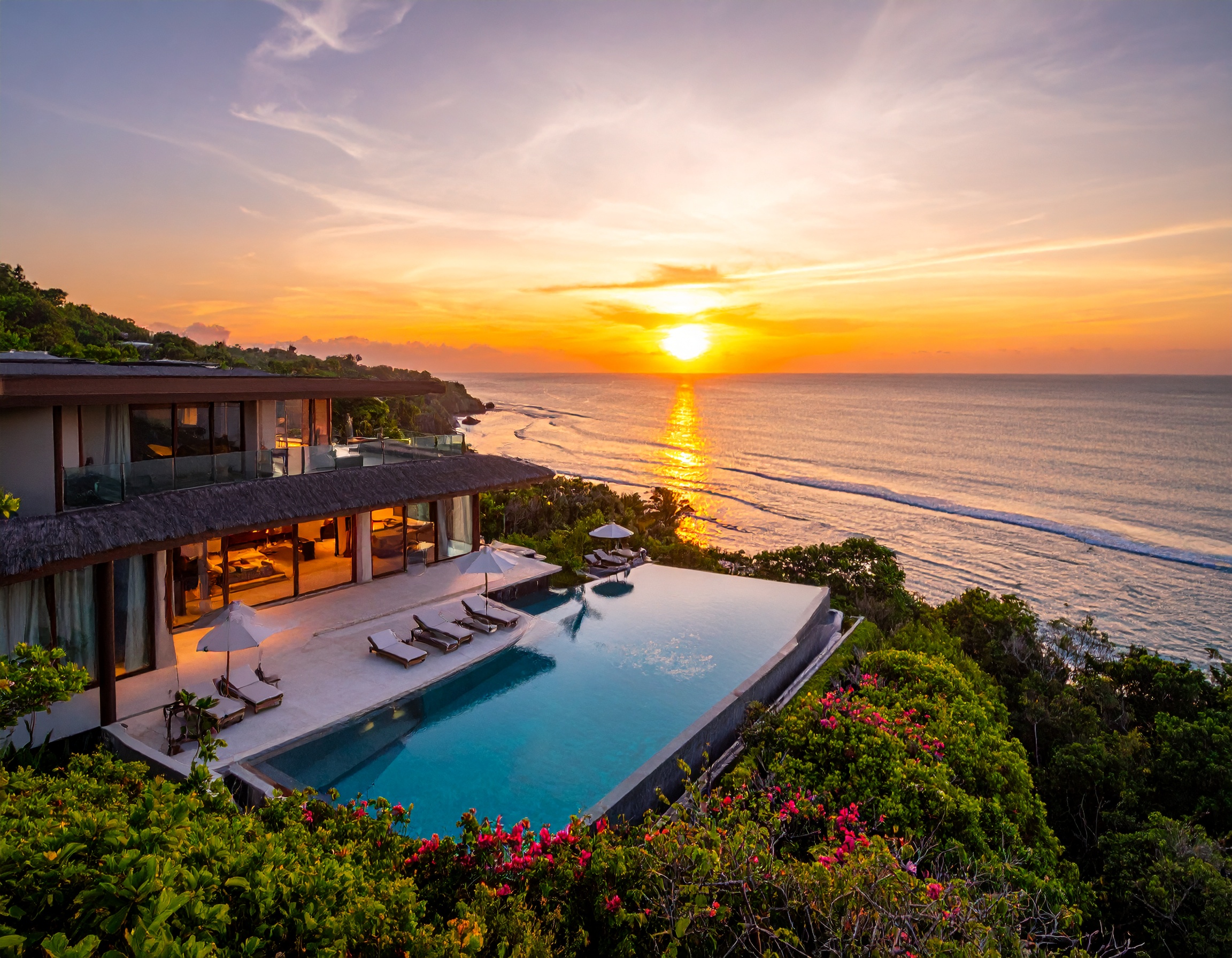 Sunset view of a luxury beachfront resort in Bali with infinity pool and ocean backdrop – 2025 travel guide.