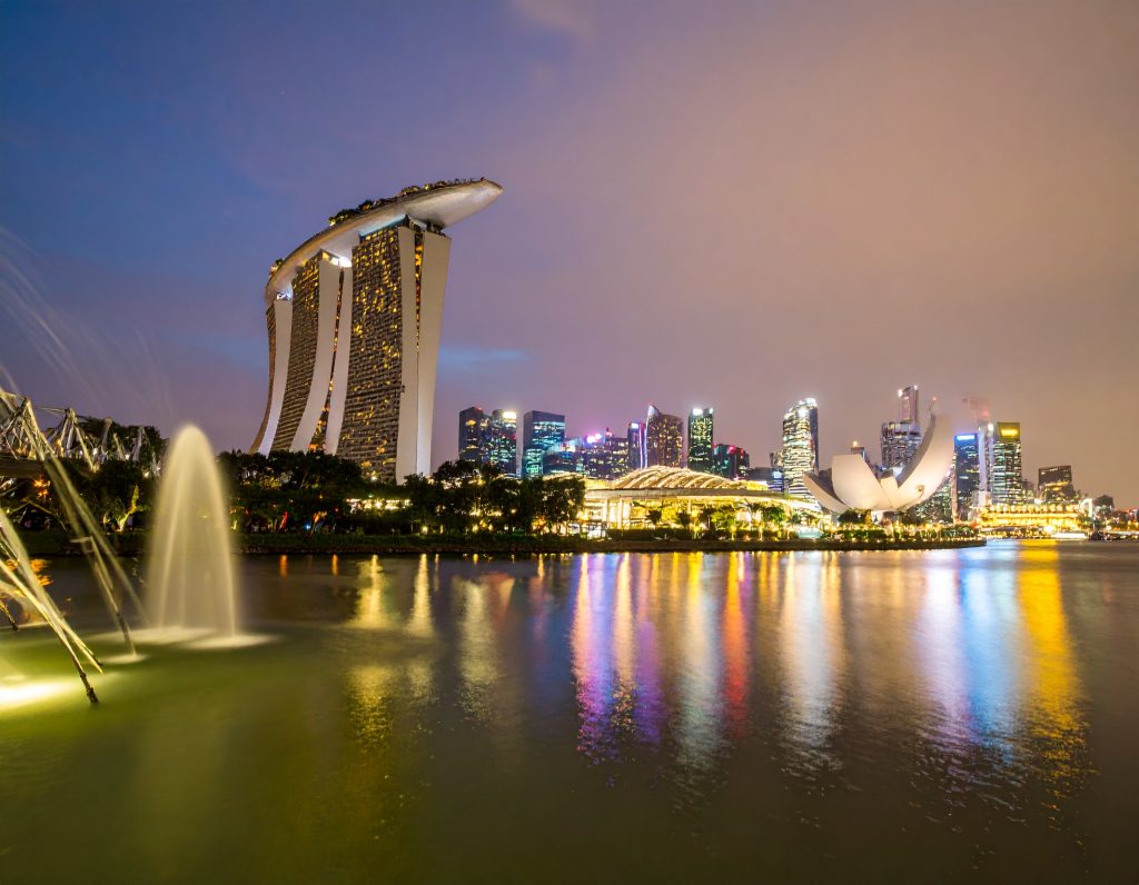 Singapore Marina Bay skyline at night with Gardens by the Bay Supertrees illuminated, perfect for layover travellers in 2025.