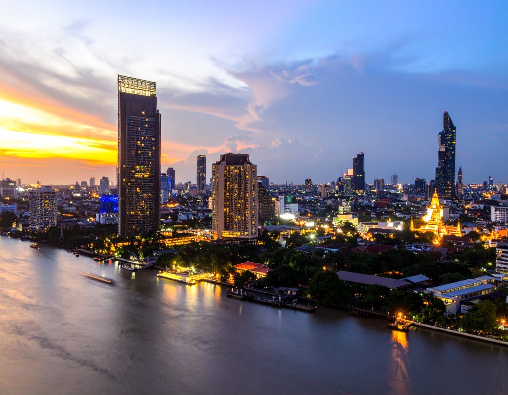 Aerial view of Bangkok city skyline with temples and Chao Phraya River – perfect for a long layover in 2025
