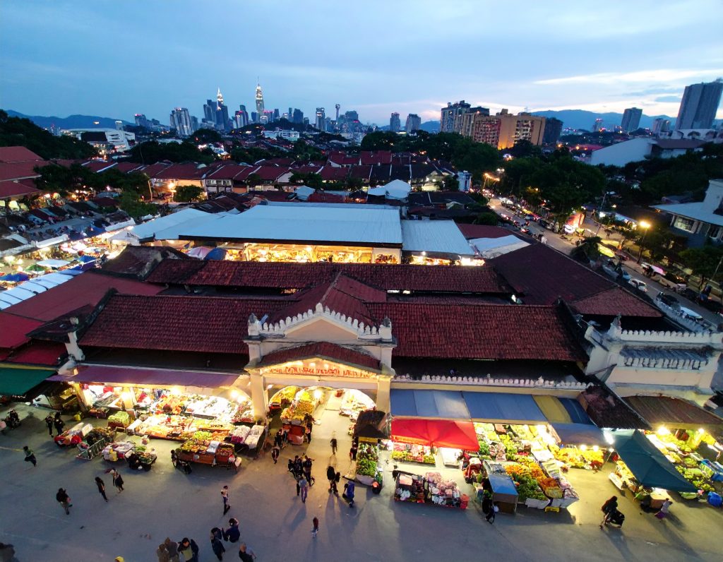 Exterior view of Central Market in Kuala Lumpur with people shopping.