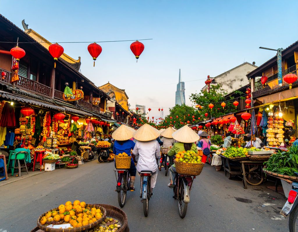 Ben Thanh Market in Ho Chi Minh City with colourful stalls and Vietnamese street food