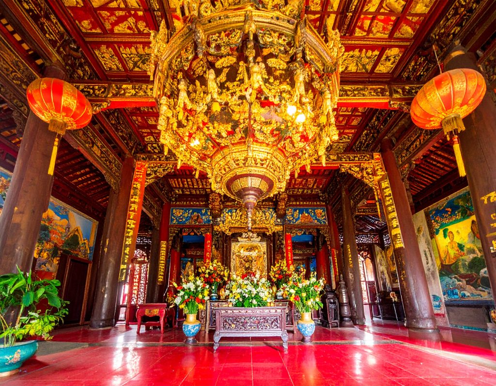 Inside Jade Emperor Pagoda in Ho Chi Minh City with incense and intricate carvings