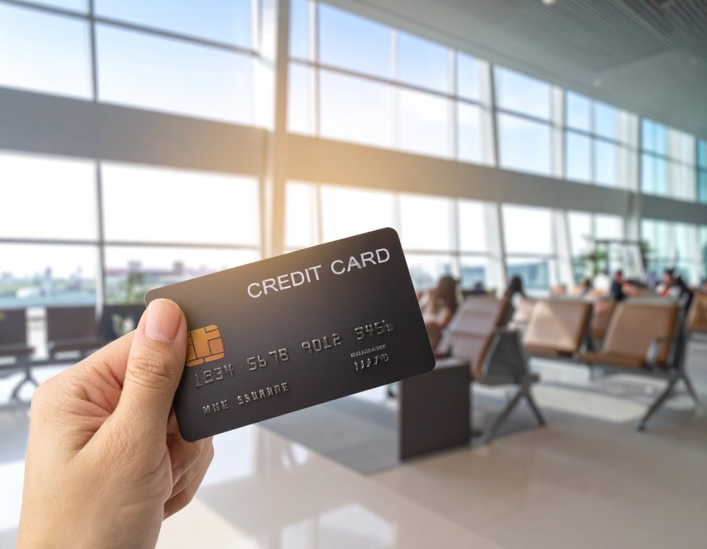 6. Conceptual image showing a credit card and airport lounge benefits for stress-free travel.