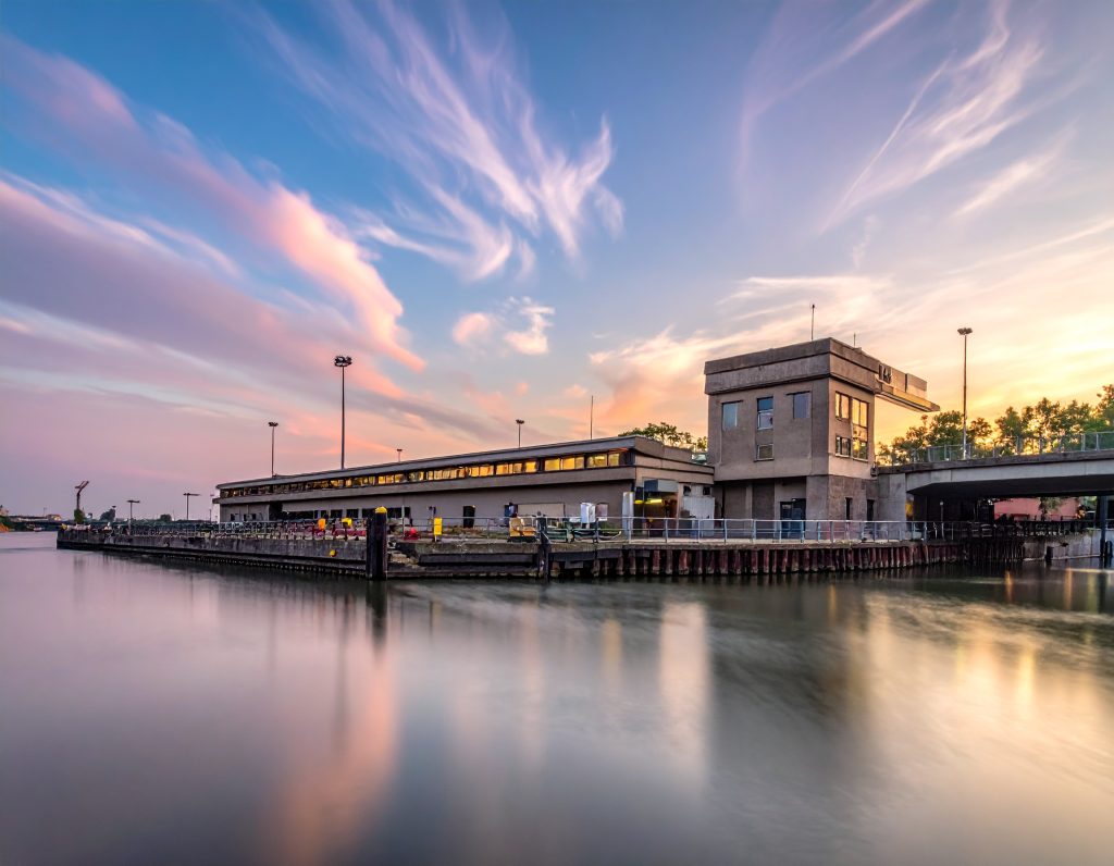 Historic Checkpoint Charlie sign and guardhouse in Berlin.