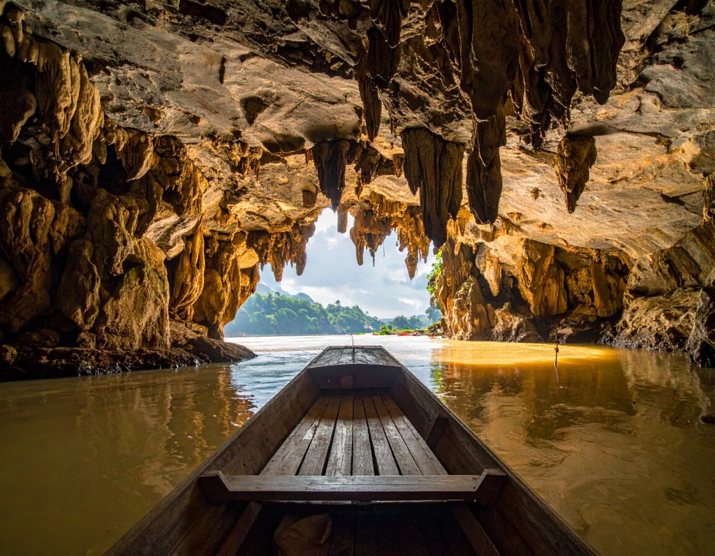 Interior of Pak Ou Caves with thousands of Buddha statues, Laos.
