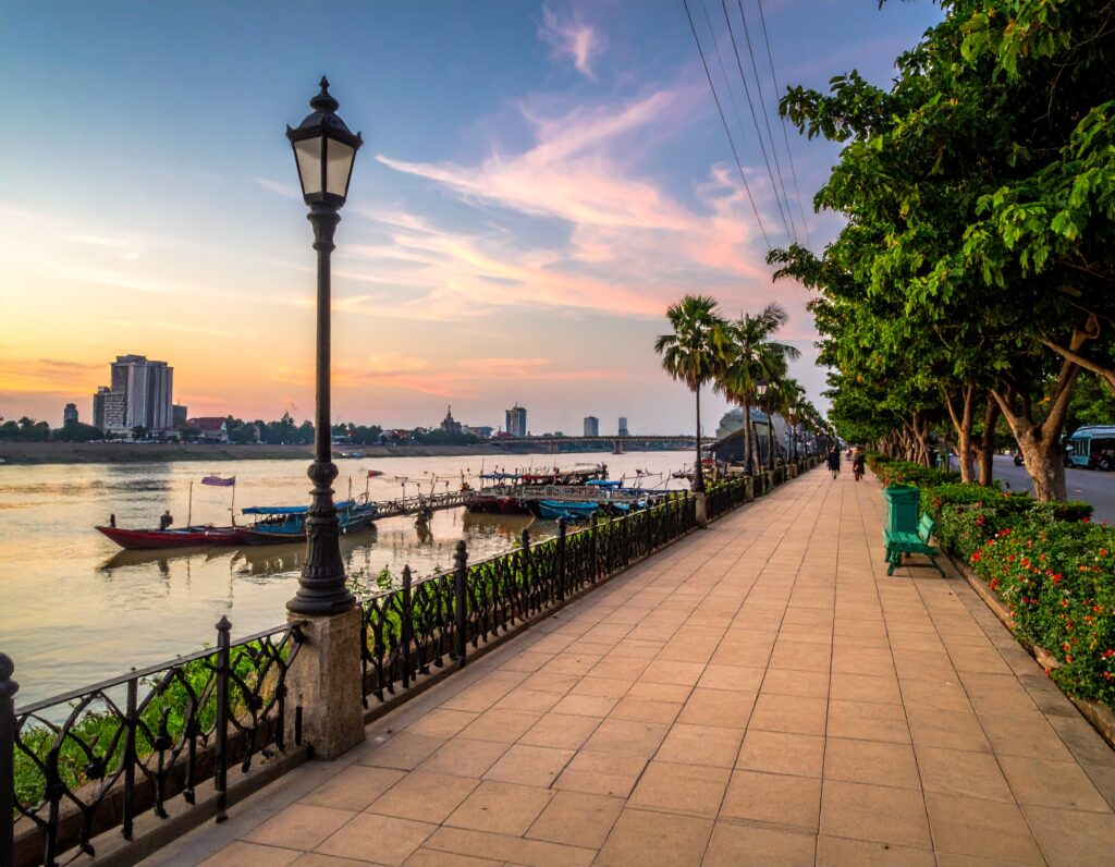 Busy riverside promenade of Sisowath Quay in Phnom Penh, Cambodia.