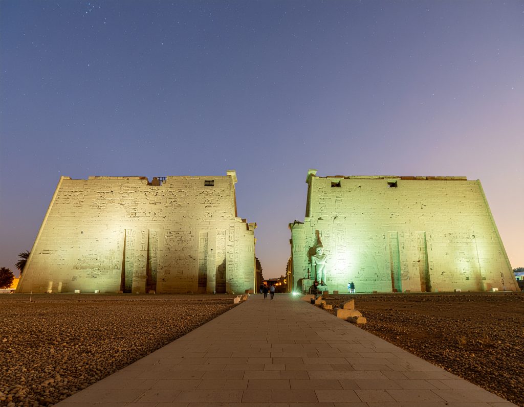 Illuminated Luxor Temple showcasing ancient Egyptian architecture.