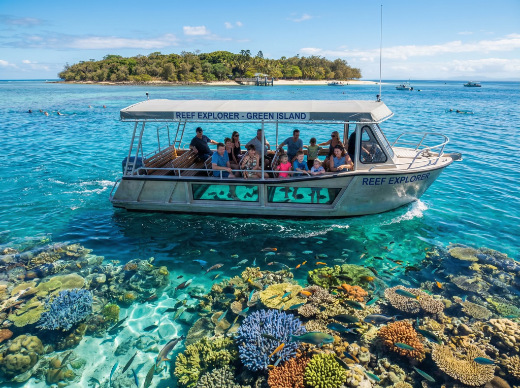 Glass-bottom boat exploring coral reef near Green Island
